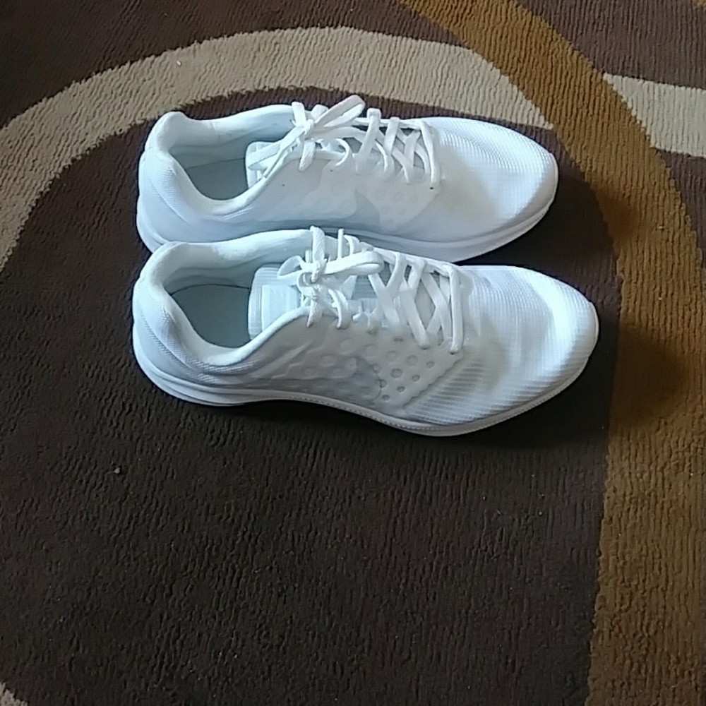 White women's Nike tennis shoe
